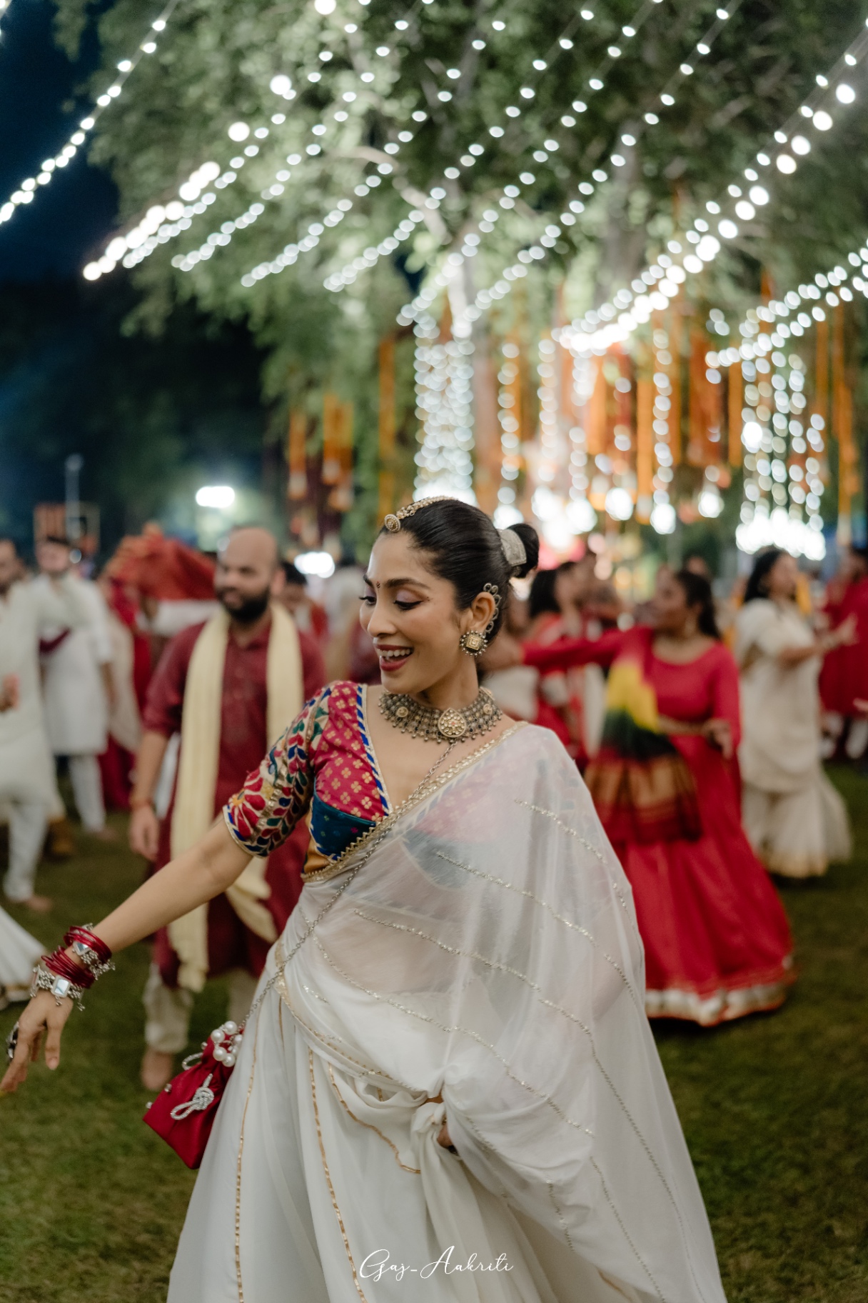 White saree, red bangles