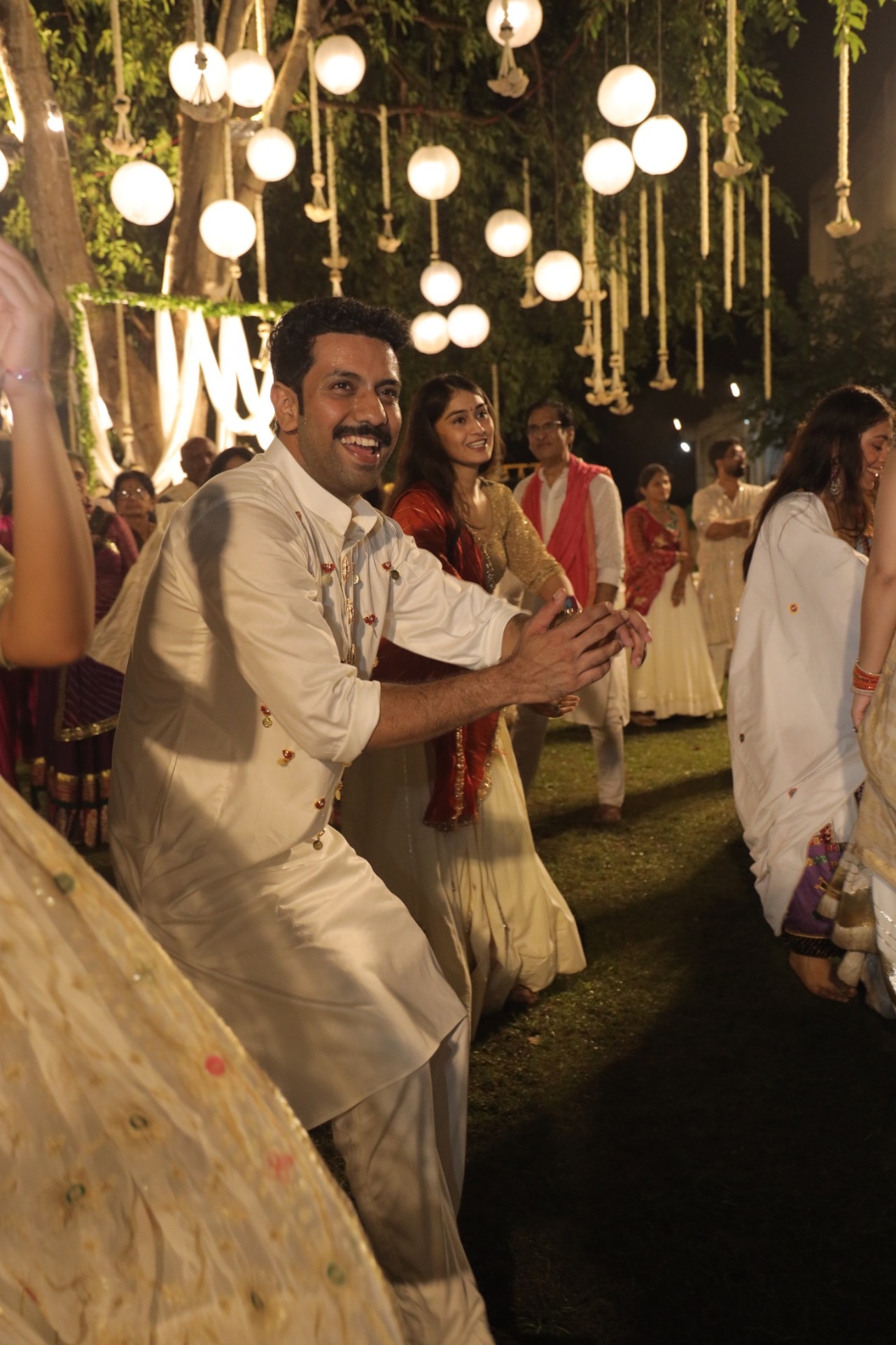 Guest dancing under lanterns