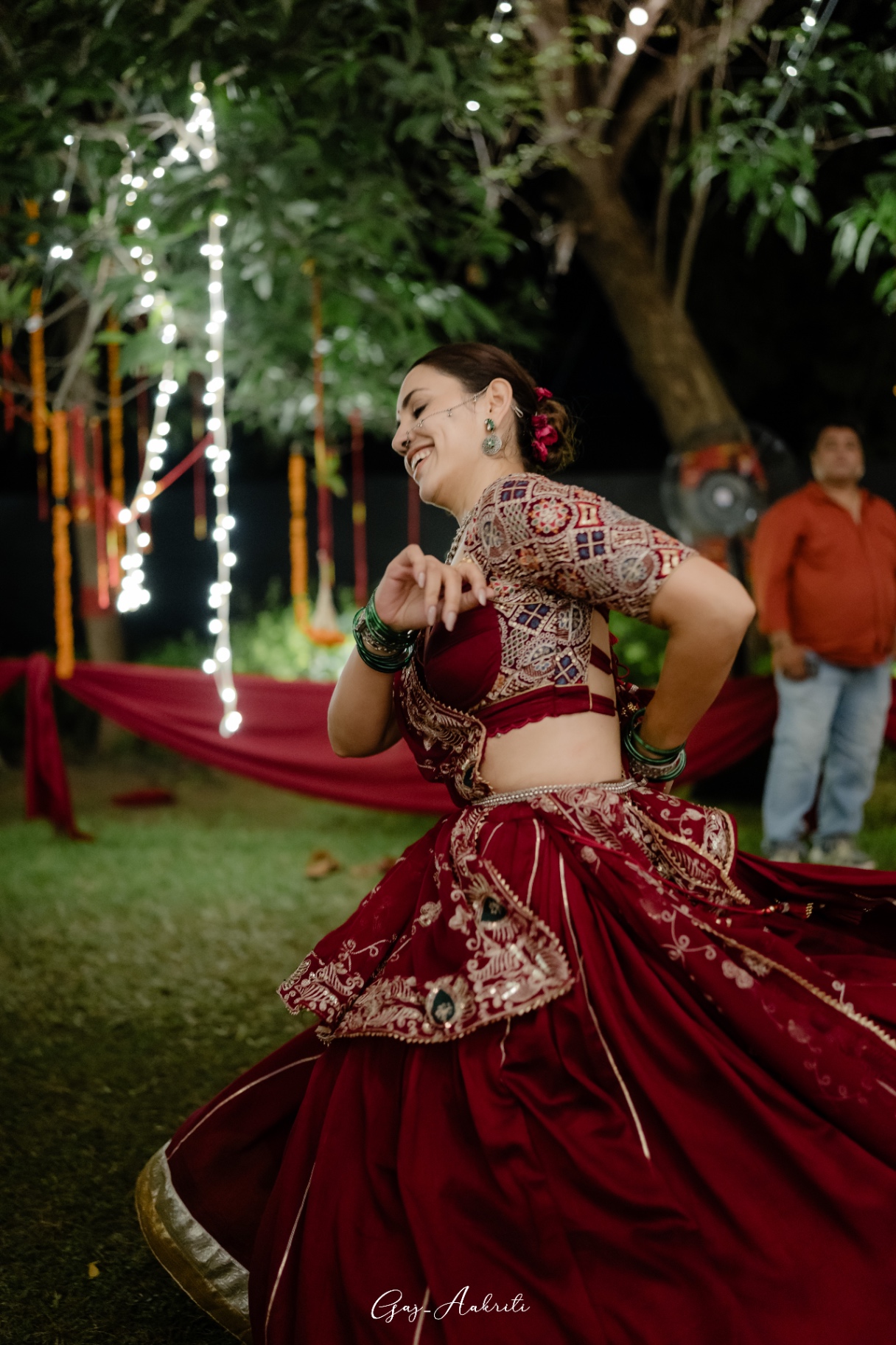 Maroon lehenga mid-spin